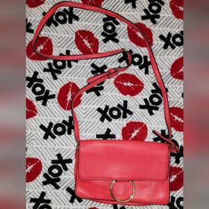 Red crossbody purse is very pretty, very nice and clean. Never used.